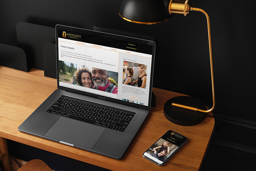 Website for Sanctuary Body on laptop and mobile screens